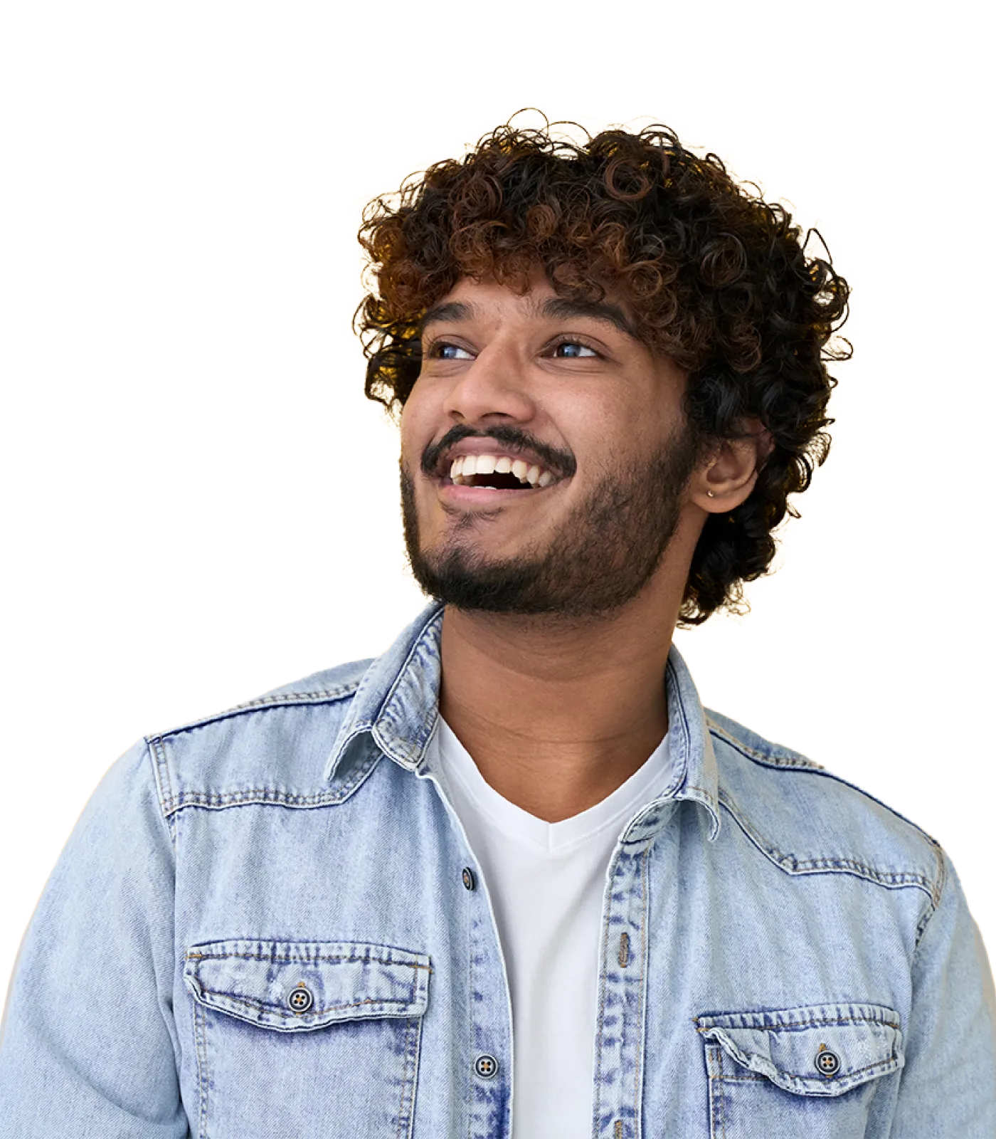 Smiling young man with curly hair dressed casually in a jean jacket over a white t-shirt.