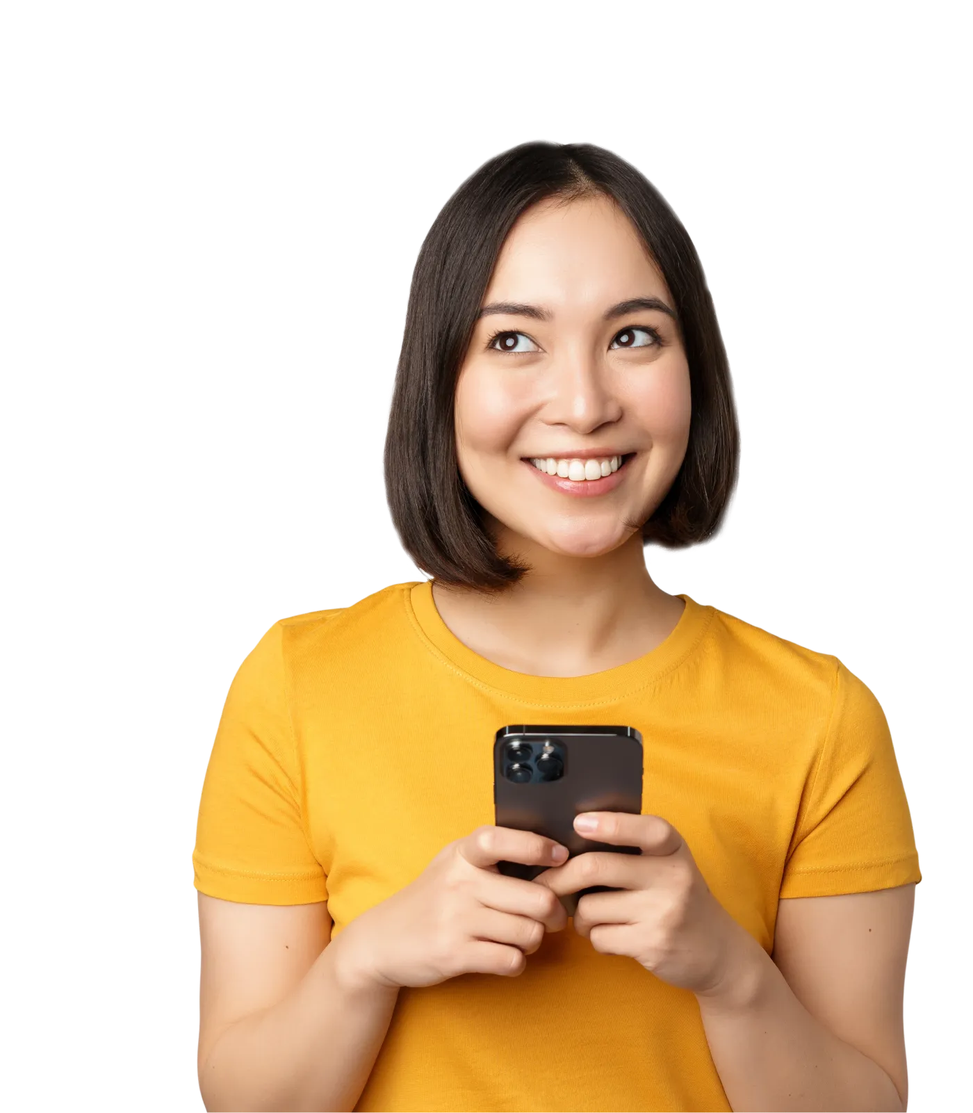 A smiling and casual young woman holding a smartphone and looking off into the distance.
